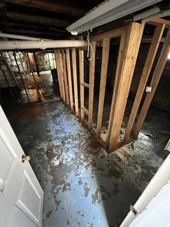 Wall framing opened up to dry after flooding