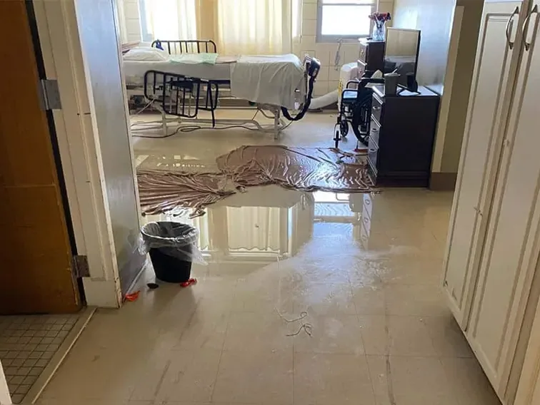 Storm water spread across a floor inside a home